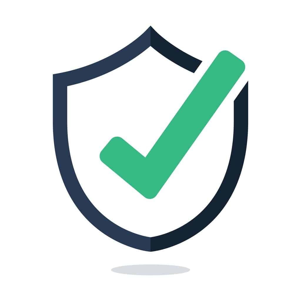 Un symbole de validation vert sur un bouclier, représentant la sécurité et la protection